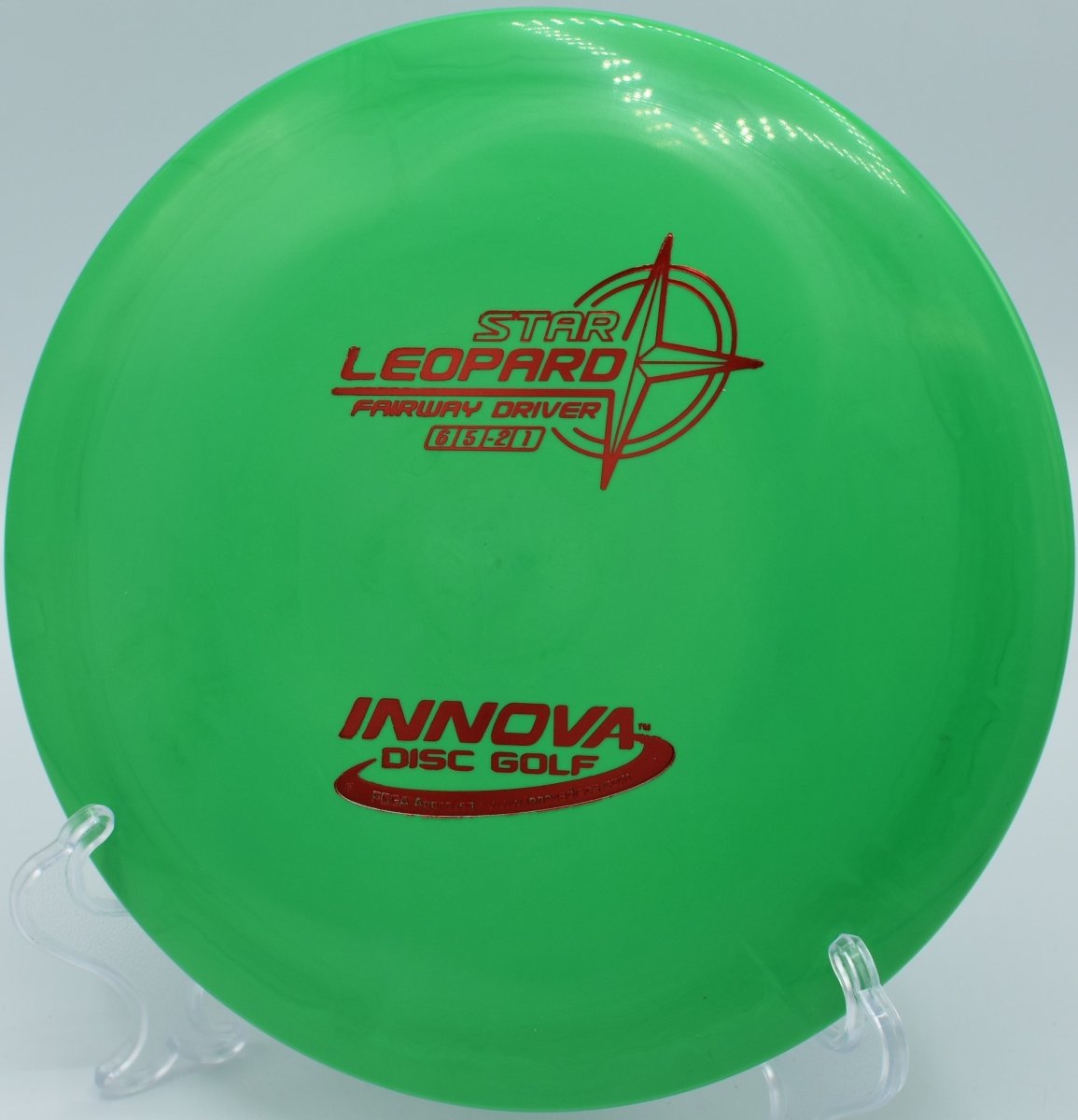 Innova Star Leopard fairway driver carving a smooth hyzer flip through wooded fairway at Hornets Nest Disc Golf Course in Charlotte, North Carolina