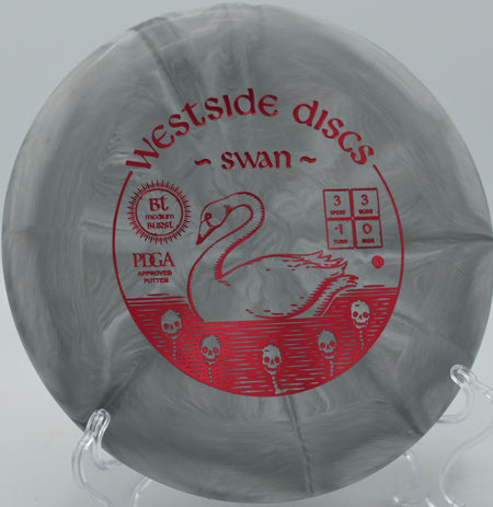 Player releasing a BT Burst Medium Swan on a gentle anhyzer line at Pine Oaks Disc Golf Course in Ocala, Florida.

