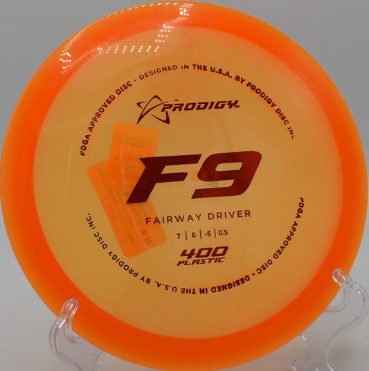 Prodigy F9 400 plastic fairway driver flying on a slow turnover at Idlewild Disc Golf Course in Burlington, Kentucky.