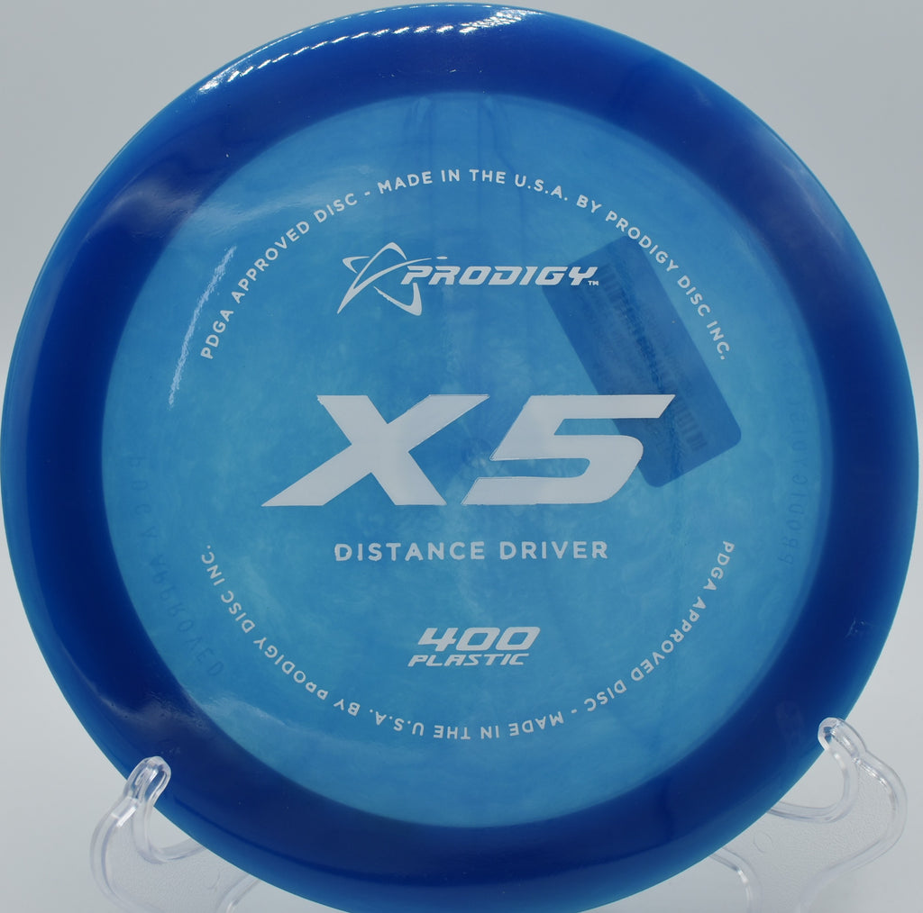 "Prodigy X5 carving a smooth hyzer-flip drive at Maple Hill Disc Golf in Leicester, MA with high glide and controlled understability."
