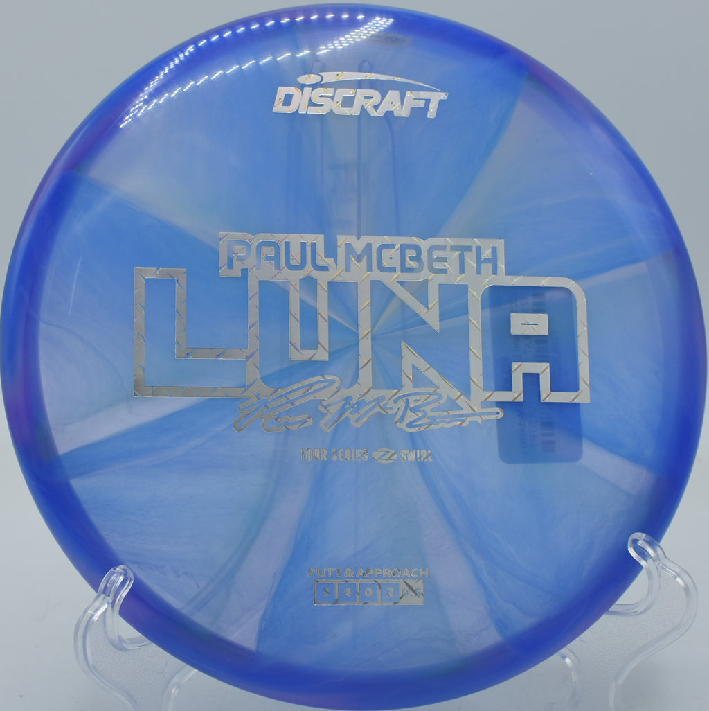 Z Swirl Luna shown mid-flight on a smooth hyzer at Bear Mountain Disc Golf Course in New York.

