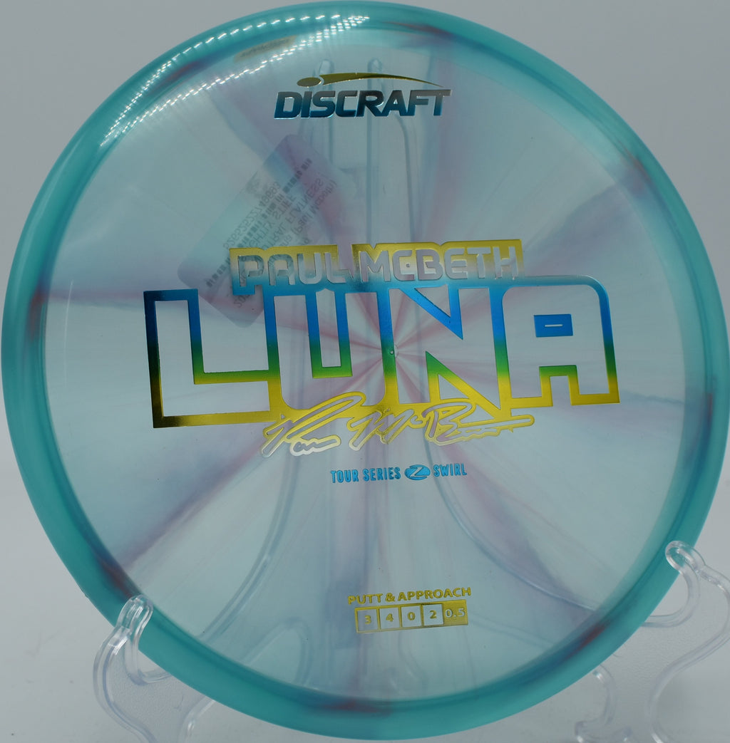 Discraft Z Swirl Luna resting against the cage at Waller Mill Park in Williamsburg, Virginia.

