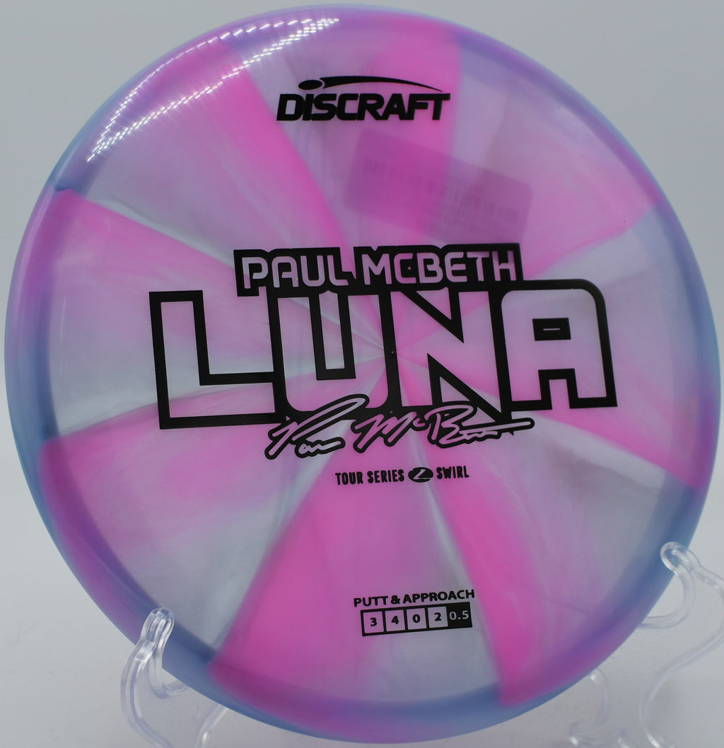Z Swirl Luna held before a circle 1 putt at Maple Hill Disc Golf Course in Leicester, Massachusetts.

