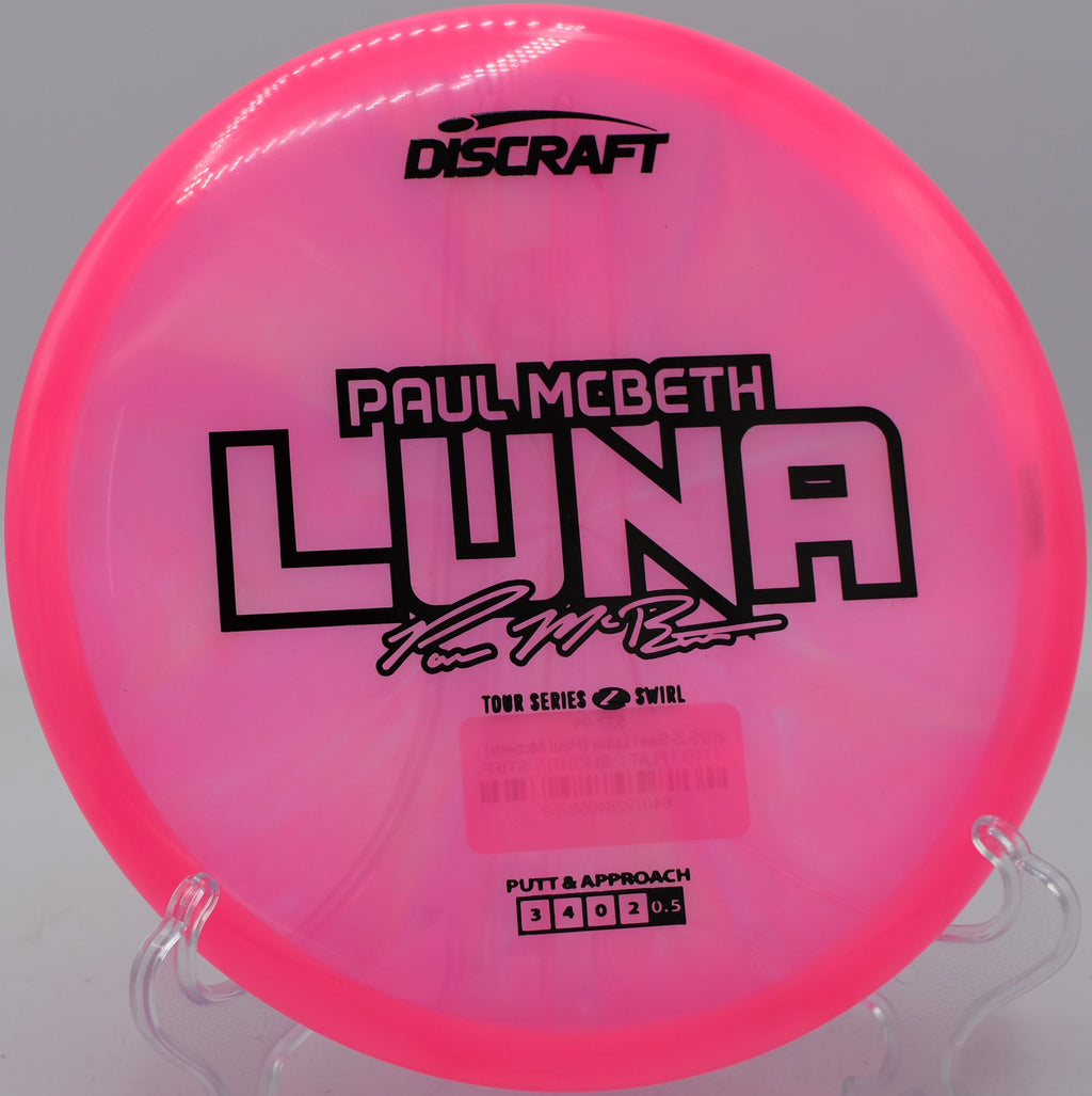 Discraft Z Swirl Luna fading gently into a guarded green at SeaTac Disc Golf Course in Washington.

