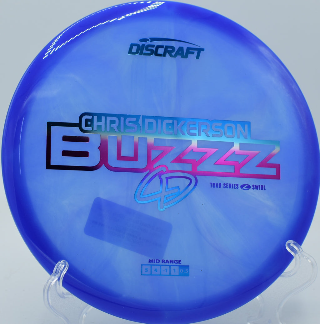 Discraft Z Swirl Buzzz gliding straight down a wooded fairway at Flip City in Michigan.

