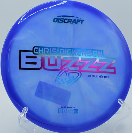 Discraft Z Swirl Buzzz gliding straight down a wooded fairway at Flip City in Michigan.

