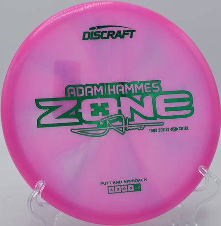 Discraft Z Swirl Zone flying flat on a forehand approach at Nevin Park in Charlotte, North Carolina.


