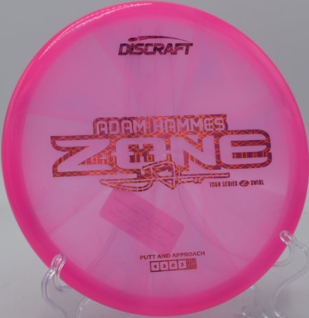 Z Swirl Zone settling softly beside the basket at Flip City Disc Golf Park in Shelby, Michigan.

