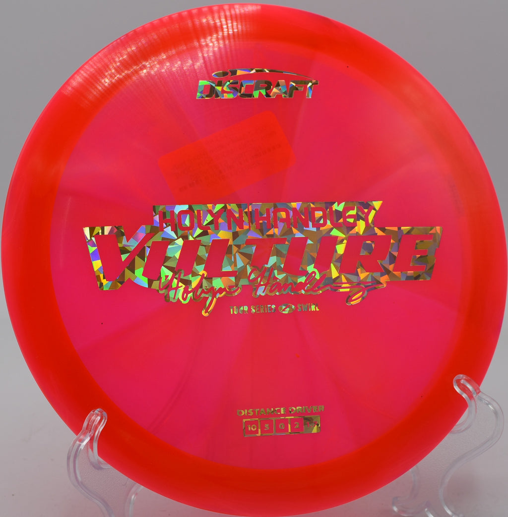 Discraft Vulture in Z Swirl plastic carving a flex shot at Harmony Bends in Columbia, Missouri.

