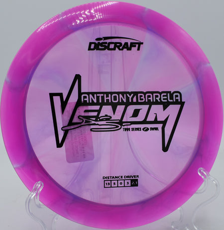 Swirled Venom cutting through a tight fairway gap at Zephyrhills Disc Golf Course in Florida.

