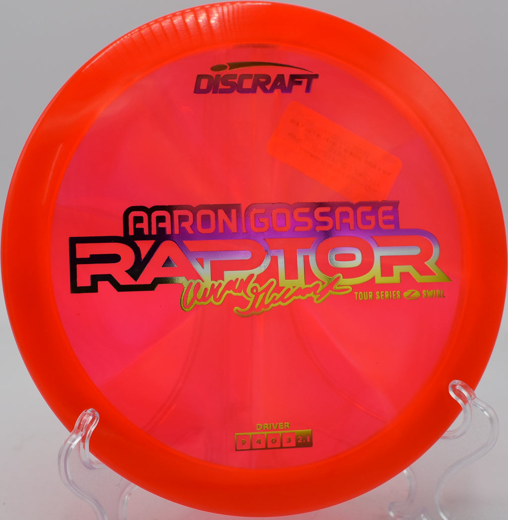 Player gripping a Z Swirl Raptor before a forehand release at Trophy Club Park in Texas.

