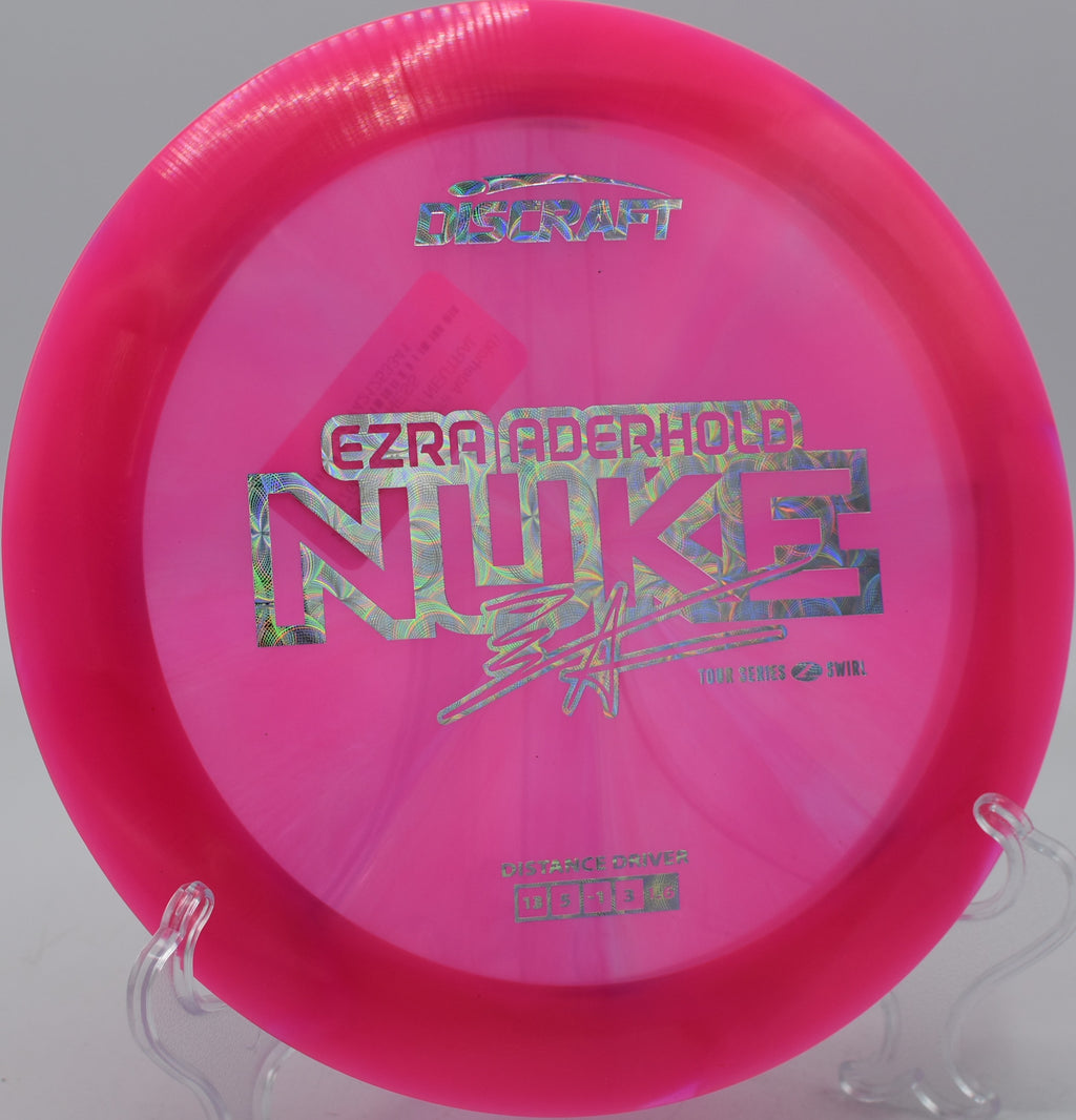 Player sending a Z Swirl Nuke forehand into the wind at Zephyrhills Disc Golf Course in Florida.

