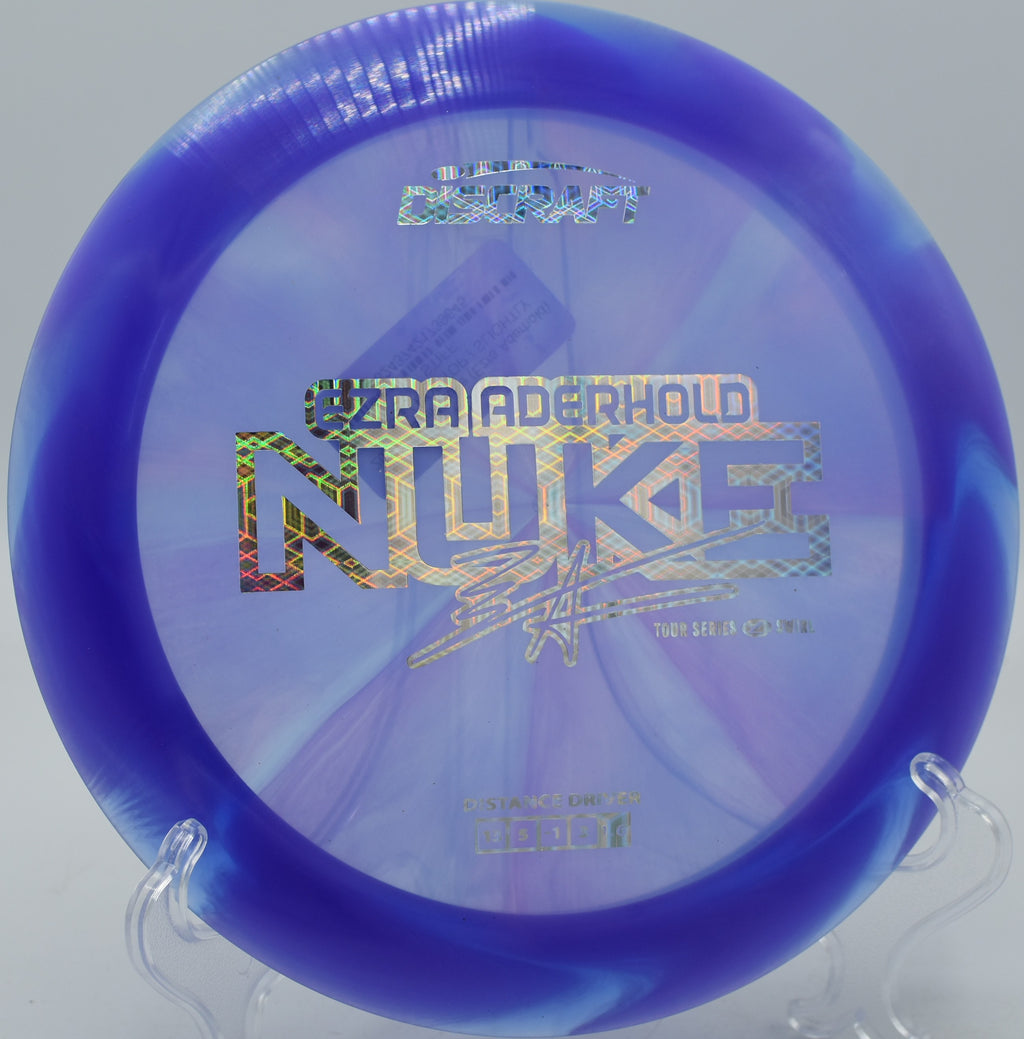 Discraft Nuke in Z Swirl plastic soaring over an open fairway at Swope Park in Kansas City, Missouri.

