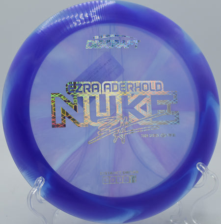 Discraft Nuke in Z Swirl plastic soaring over an open fairway at Swope Park in Kansas City, Missouri.

