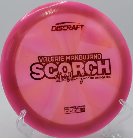 Discraft Z Swirl Scorch gliding on a hyzer flip at Idlewild Disc Golf Course in Burlington, Kentucky.


