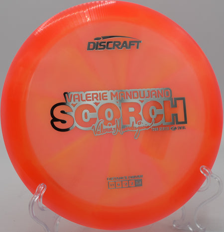 Discraft Scorch in Z Swirl plastic flying long and low at Sunset Hills DGC in Pekin, Illinois.

