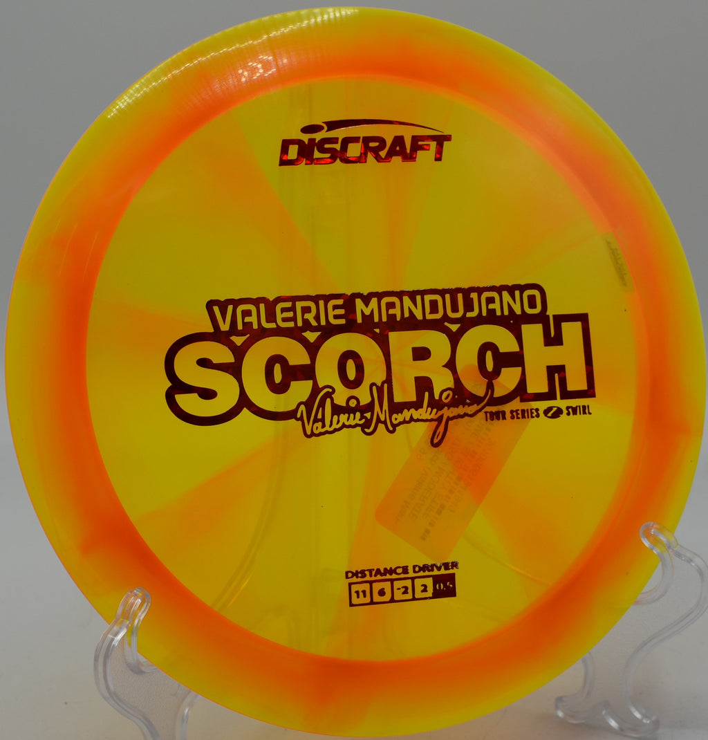 Z Swirl Scorch gliding down a hill at SeaTac Disc Golf Course in Washington.

