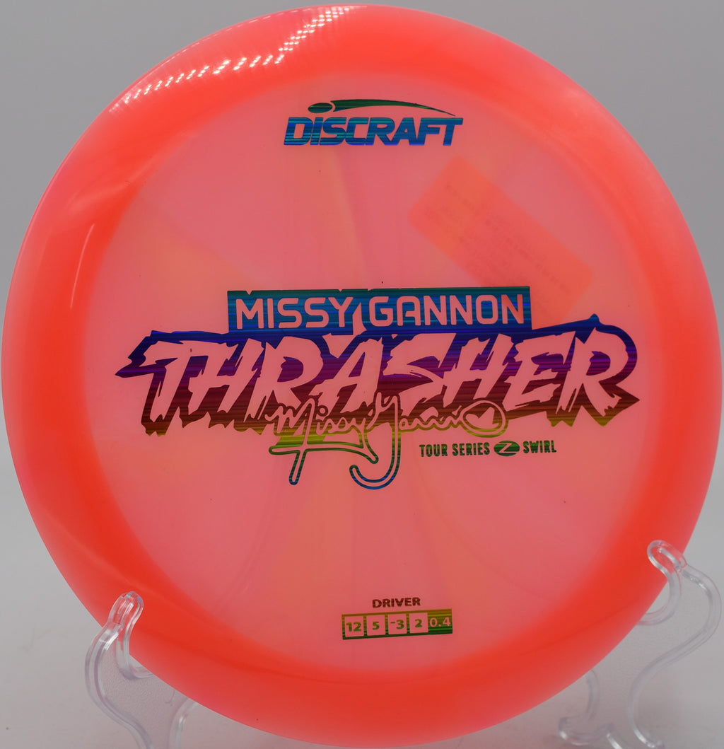 Discraft Z Swirl Thrasher flipping to flat on a wide open fairway at Milo McIver State Park in Estacada, Oregon.

