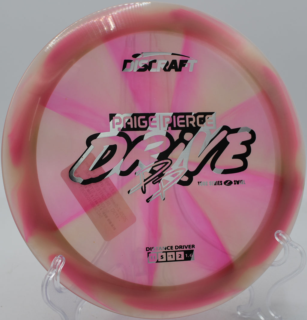 Discraft Z Swirl Drive flying flat with smooth fade at Maple Hill Disc Golf Course in Leicester, Massachusetts.

