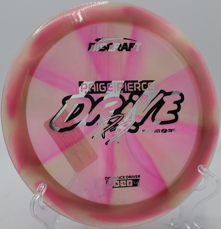 Discraft Z Swirl Drive flying flat with smooth fade at Maple Hill Disc Golf Course in Leicester, Massachusetts.

