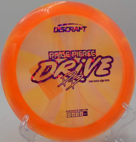 Discraft Z Swirl Drive mid-flight on a turnover drive at Nevin Park in Charlotte, North Carolina.

