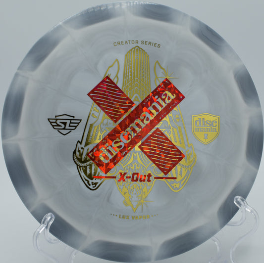 "Discmania Lux Vapor Tilt, an extremely overstable distance driver designed for extreme angles and skips, now available at Flexline Discs in Atlanta, GA."
