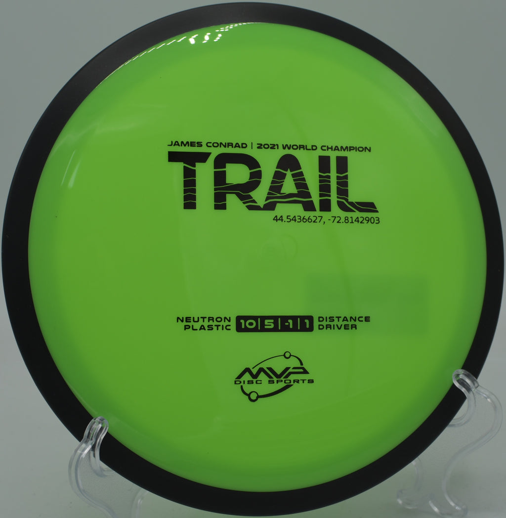Glow from sunset reflecting on a Neutron Trail mid-flight at SeaTac Disc Golf Course in Washington

