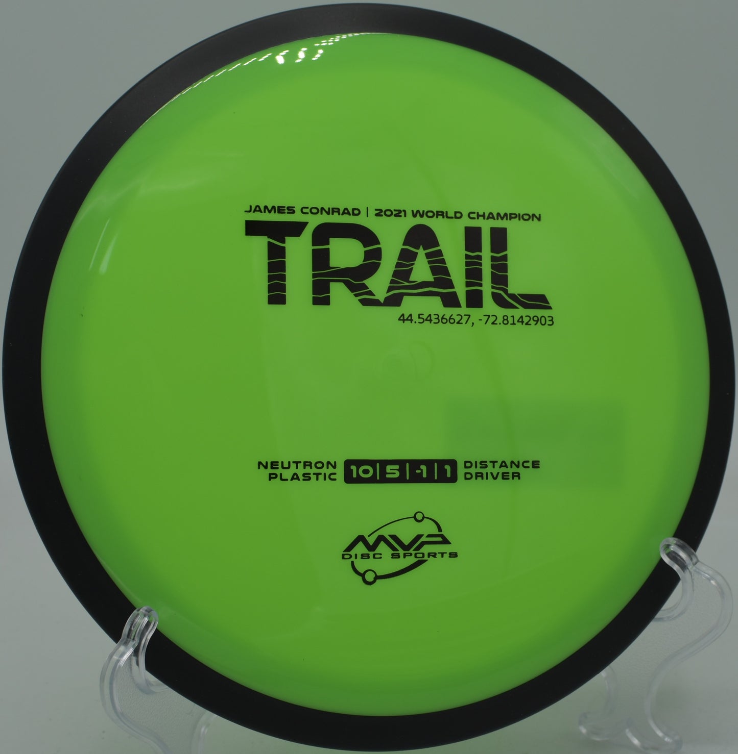 Glow from sunset reflecting on a Neutron Trail mid-flight at SeaTac Disc Golf Course in Washington

