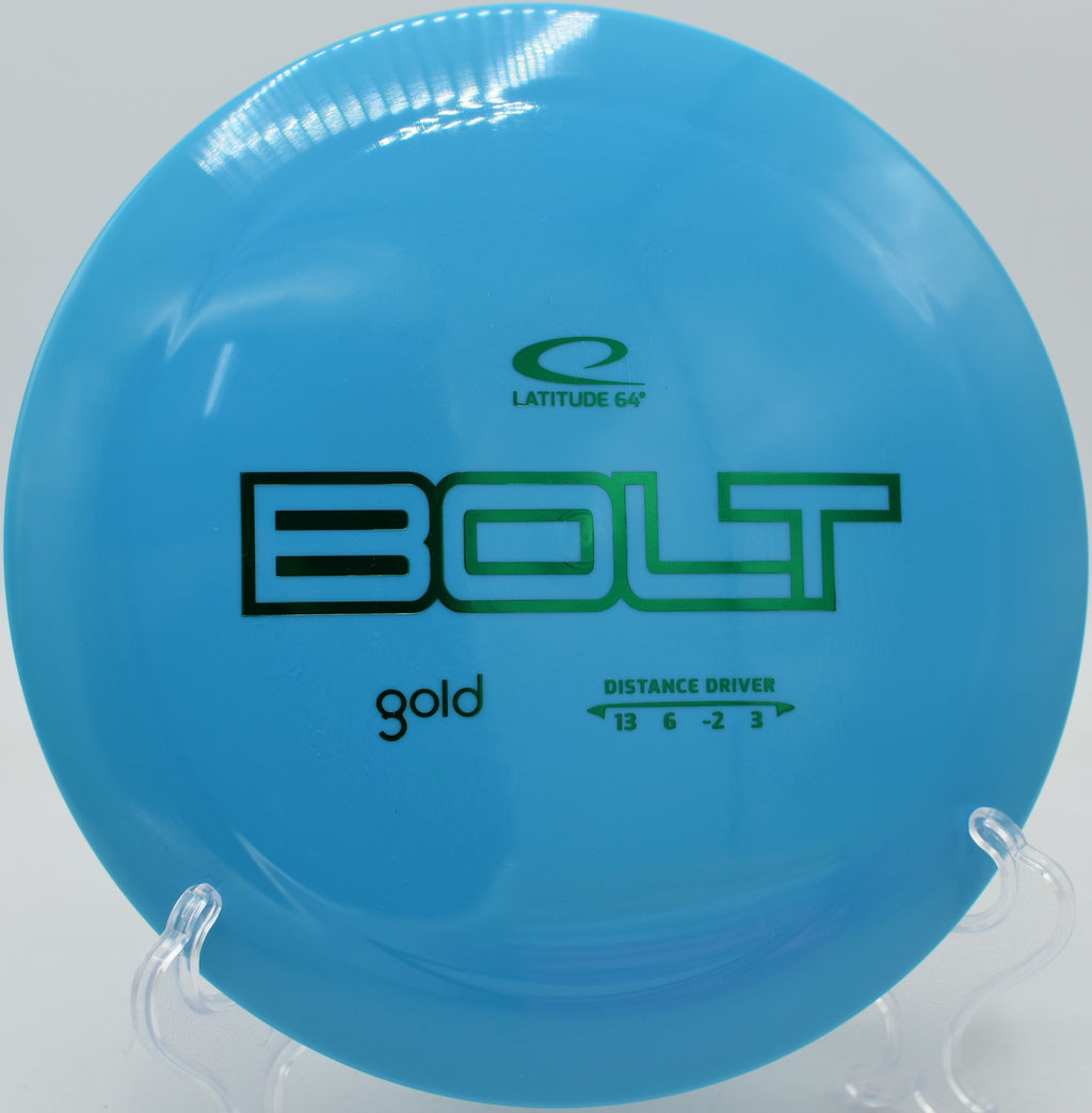 Gold Bolt mid-flight over open field at Sunset Hills DGC in Pekin, Illinois

