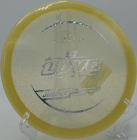 Ty Love’s Lucid Gold Justice fading sharply into the green at Maple Hill Disc Golf Course in Leicester, Massachusetts.

