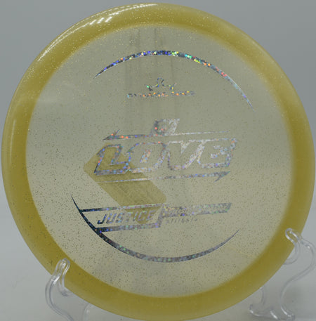 Dynamic Discs Lucid Gold Metal Flake Justice battling a headwind at Whispering Falls DGC in Greencastle, Pennsylvania.

