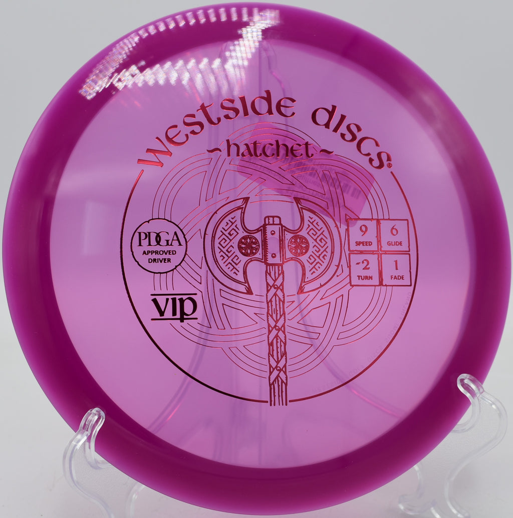 Westside Discs VIP Hatchet turning gently through a wooded fairway at Iron Hill Disc Golf Course in Newark, Delaware

