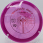 Westside Discs VIP Hatchet turning gently through a wooded fairway at Iron Hill Disc Golf Course in Newark, Delaware

