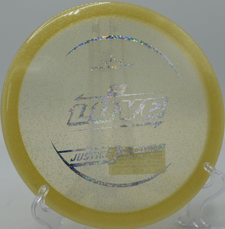Tour Series Justice glowing with metallic flakes on a power hyzer at Rock Ridge DGC in Pittsboro, North Carolina.

