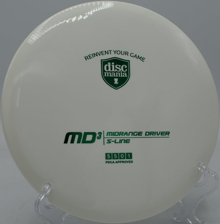 Close-up of the S-Line MD3’s glossy plastic and rim resting on the tee pad at Rocklin Disc Golf Course in California

