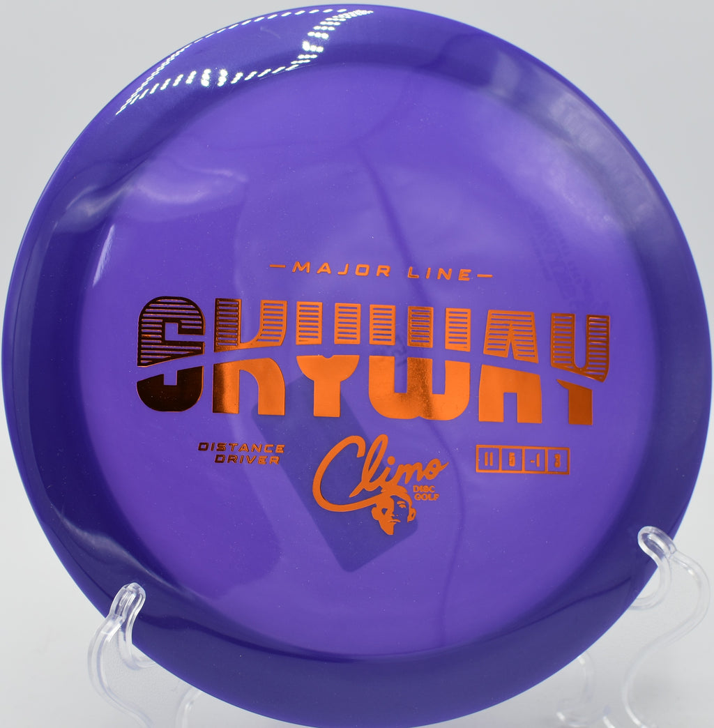 Climo Discs Skyway fading hard around a corner at DeLaveaga Disc Golf Course in Santa Cruz, California.

