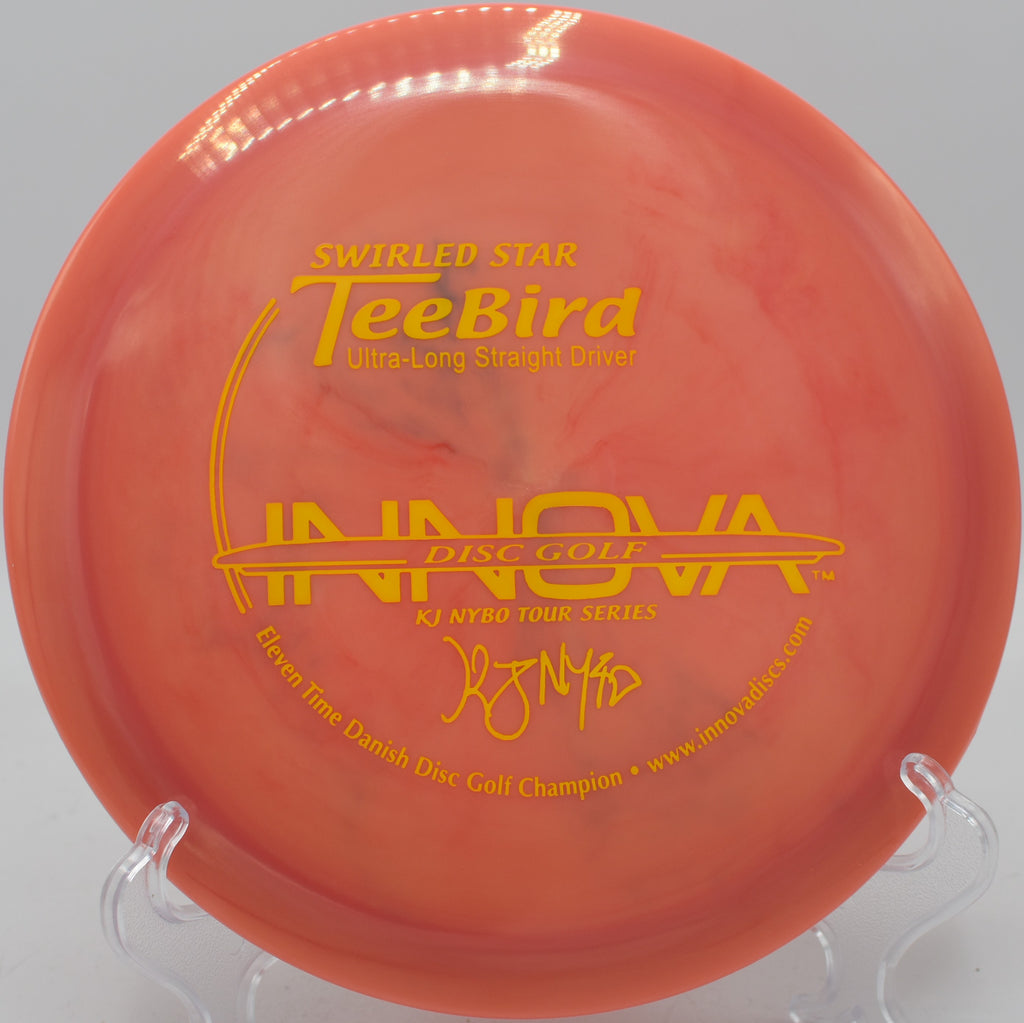 Innova Swirly Star TeeBird mid-flight on a touch anhyzer at SeaTac Disc Golf Course in Washington


