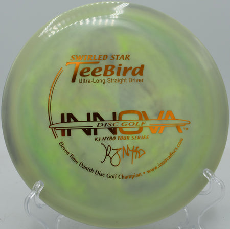 Swirly Star TeeBird flying through a windy open hole at Jonesboro Disc Golf Course in Arkansas

