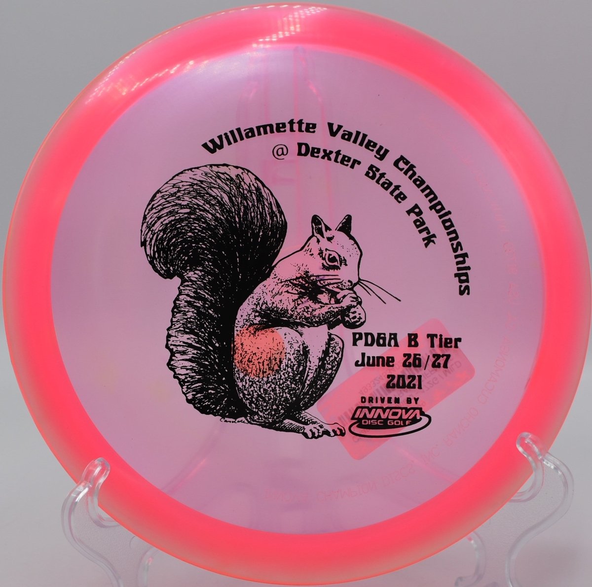 Champion Leopard fairway driver executing a long glide shot through open fairway at Buffumville Lake Disc Golf Course in Charlton, Massachusetts