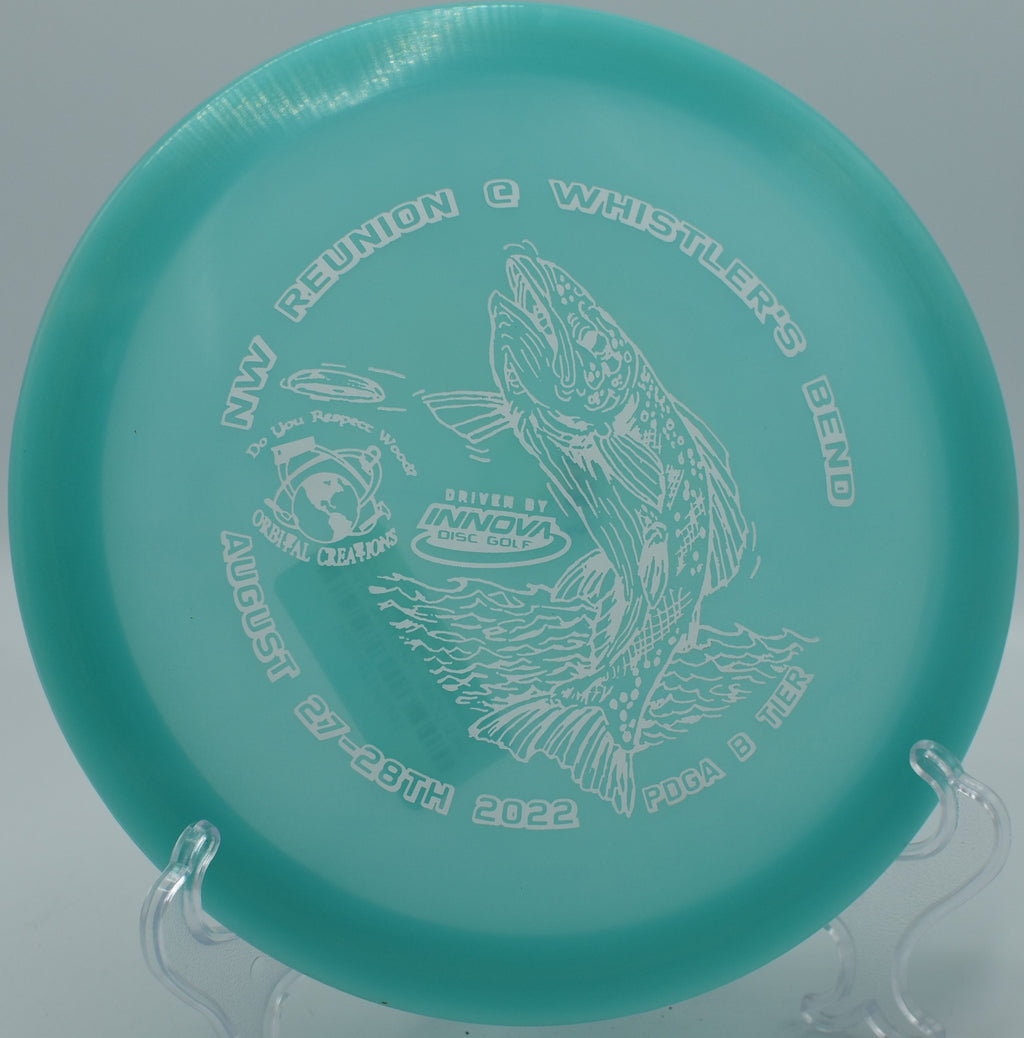 Innova Champion Glow Eagle glowing brightly as it fades toward the pin on Hole 10 at Whispering Falls Disc Golf Course, Meadville, Pennsylvania.
