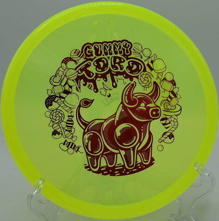 Gummy Champion Toro carving a steep hyzer line through trees on Hole 10 at Wilderness Campground Disc Golf Course, Montello, Wisconsin.
