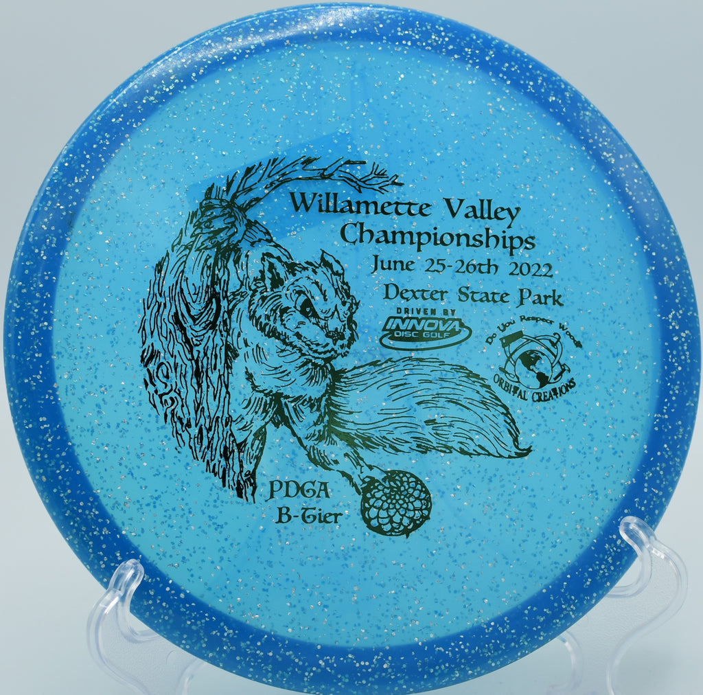 Innova Gator locking onto the basket with a precise hyzer approach on Hole 4 at Timberwolf Disc Golf Course, Dryden, Michigan.






