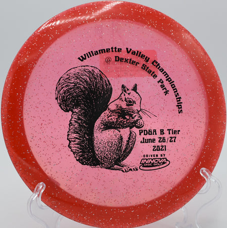 Champion Metalflake Roadrunner rolling down the fairway on Hole 6 at Kincaid Park Disc Golf Course, Anchorage, Alaska.
