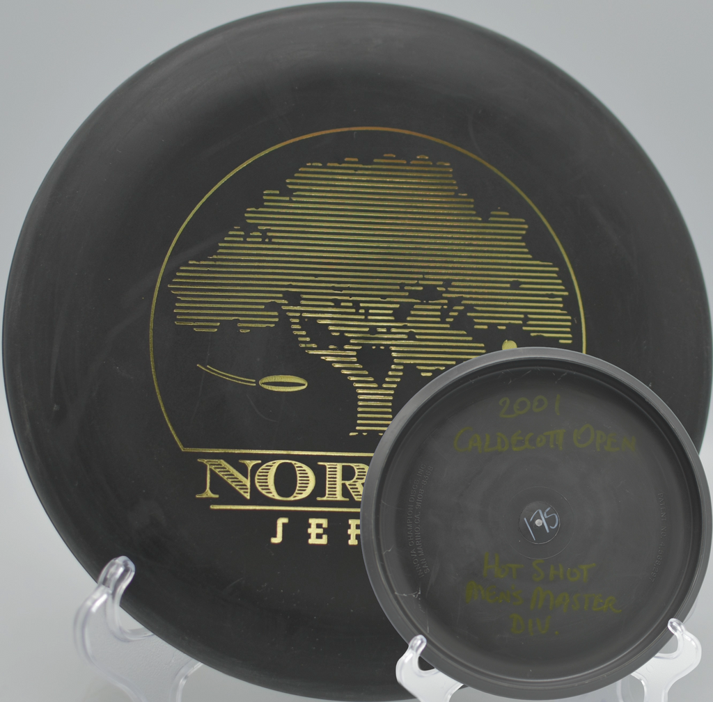 Black 2-Ring San Marino Microbead Aviar w/Pat# (NorCal Series 97–02) catching chains in the morning light at Golden Gate Park Disc Golf Course in San Francisco, California.