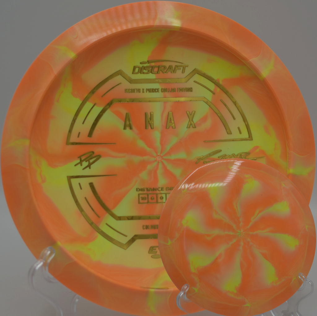 Paige Pierce & Paul McBeth ESP Anax Collab sitting on turf at Roy G. Guerrero DGC in Austin, TX, built for long, confident flights.