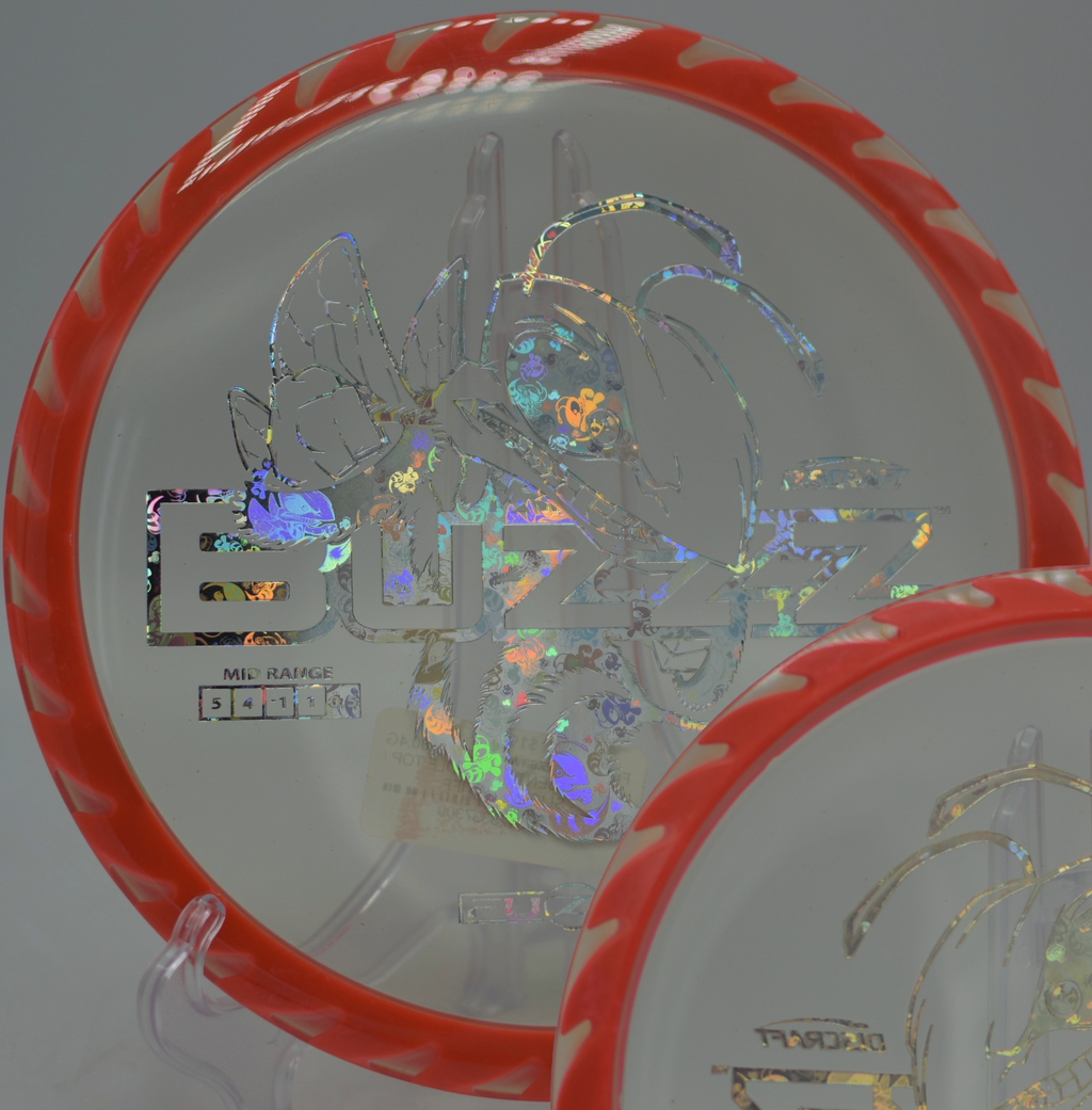 Fuzed Buzzzsaw gliding through a technical wooded lane at Quaker’s Challenge Disc Golf Course in Franklin, Pennsylvania.