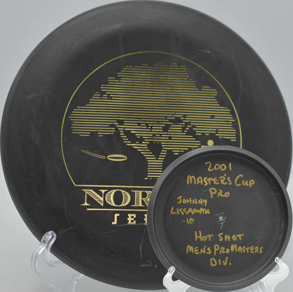 Black 2-Ring San Marino Microbead Aviar w/Pat# (NorCal Series 97–02) dropping softly into chains at Rotary Playfield Disc Golf Course in Santa Rosa, California.