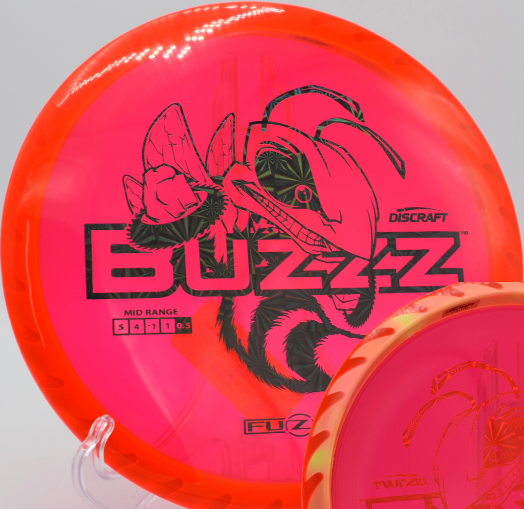 Fuzed Buzzzsaw flying over open terrain at Eagles Crossing in Hawk Point, Missouri, perfect for aggressive forehands and controlled hyzer lines.


