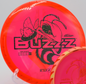 Fuzed Buzzzsaw flying over open terrain at Eagles Crossing in Hawk Point, Missouri, perfect for aggressive forehands and controlled hyzer lines.

