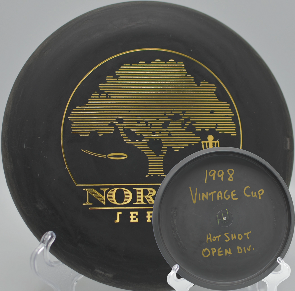 Black 2-Ring San Marino Microbead Aviar w/Pat# (NorCal Series 97–02) gliding toward the chains at Stafford Lake Disc Golf Course in Novato, California.